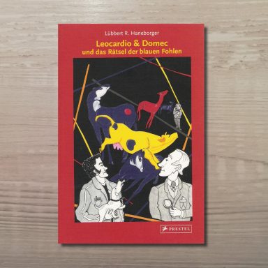 Buchcover mit dem Titel 'Leocardio & Domec' zeigt stilisierte Figuren und bunte Pferde auf schwarzem Hintergrund, umrahmt von rotem Rahmen.