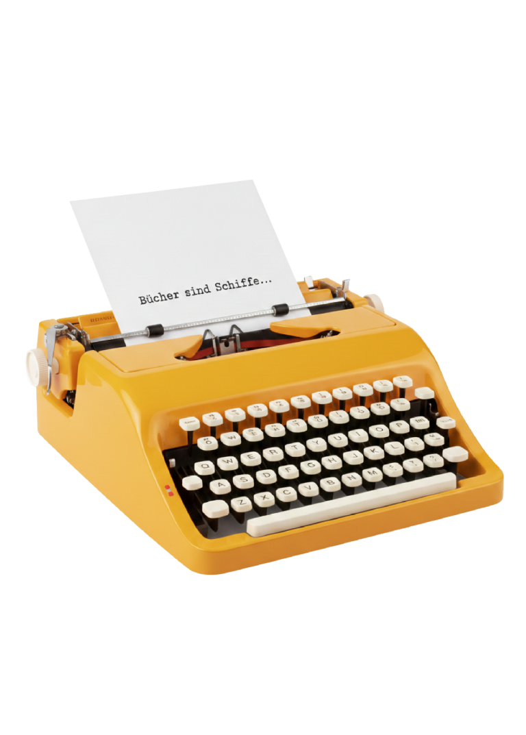 Alte gelb-orange Schreibmaschine mit weißem Papier, auf dem 'Bücher sind Schiffe...' steht.